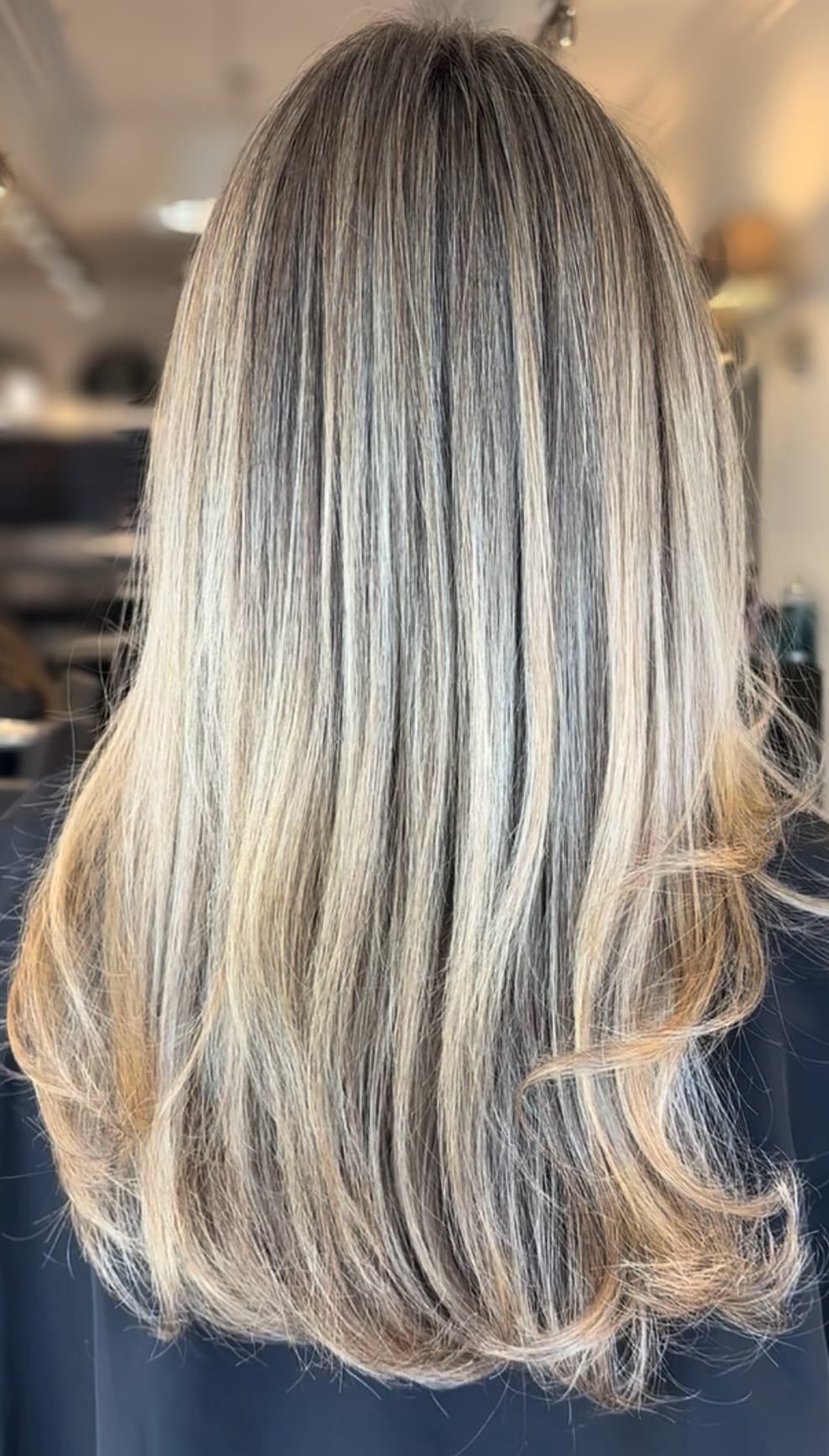 Sunkissed blonde balayage result on straight hair.