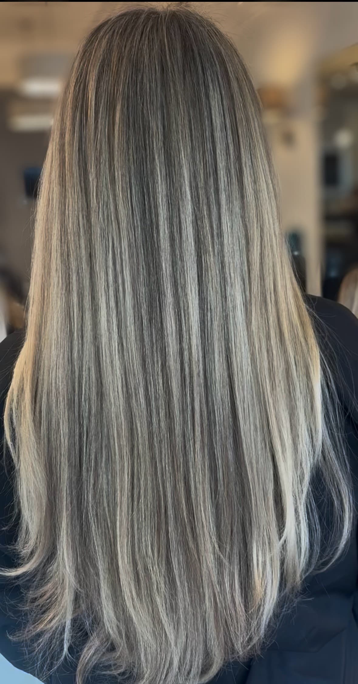 Soft, dimensional blonde color result on straight hair.